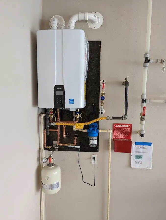 Professional plumber installing copper piping in a Itasca home